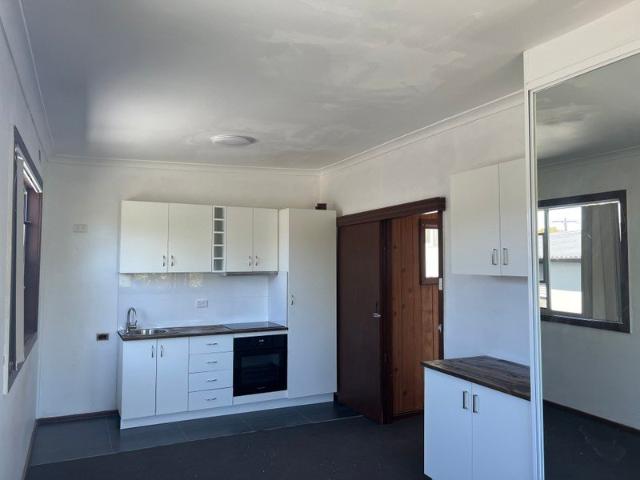 Open plan studio with private ensuite, kitchen mirrored built in robes