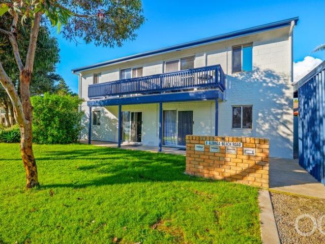 Open the Door to a Comfortable Beachside Unit, Steps From the Sand
