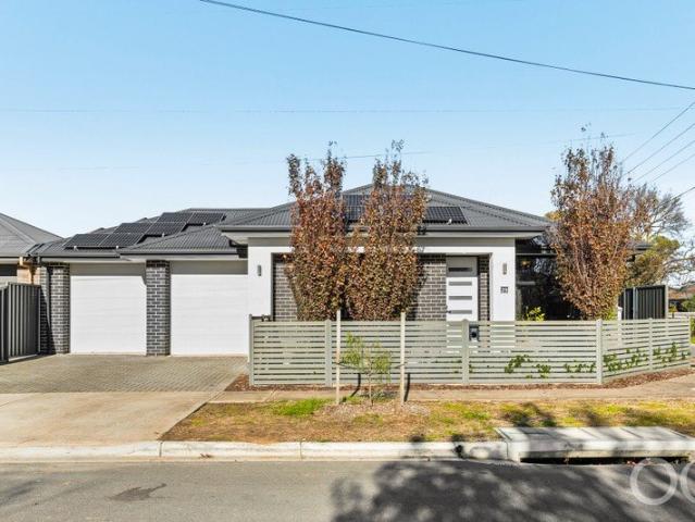 Open the Door to a Cornered, Solar Powered Home with Parks and City in Reach