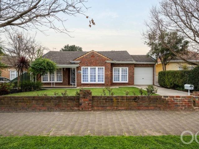 Open the Door to a Clinker Brick Colonial Beauty with a Sun Seeking Extension