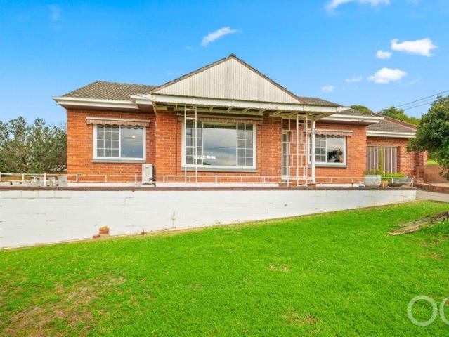 Open the Door to a Solid Corner Home, City To Sea Views and Permission to Dream Big