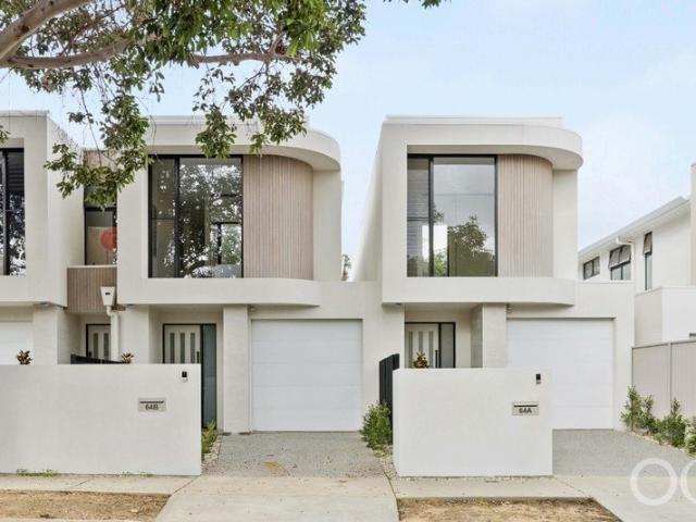 Open the Door to a Townhouse Pair With Curve Appeal and New Build Perks