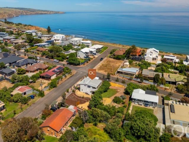 Open the Door to Barefooted Beachside Bliss with a Double Title Advantage