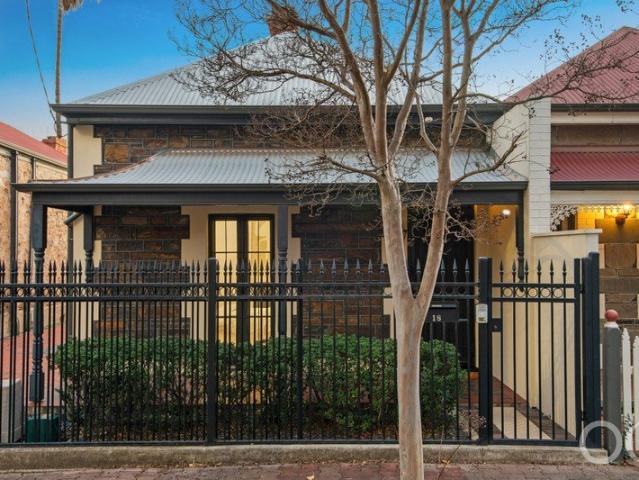 Open the Door to City Edge Living with Parking, Space and Coveted School Zoning