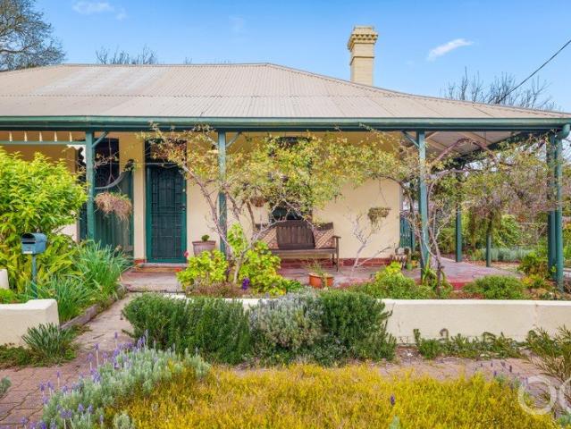 Open the Door to Classic Cottage Charm & Convenient Living