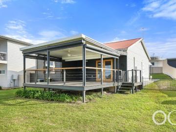 Open the door to coastal comfort & entertaining at its best