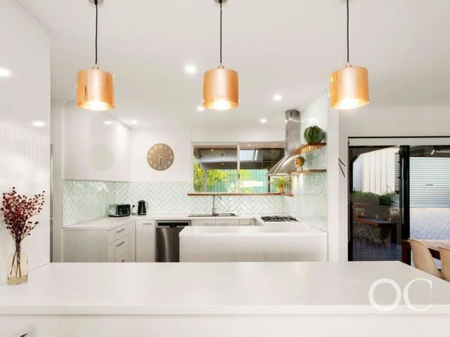 Open the Door To Coastal Entertaining Just Moments from the Beach