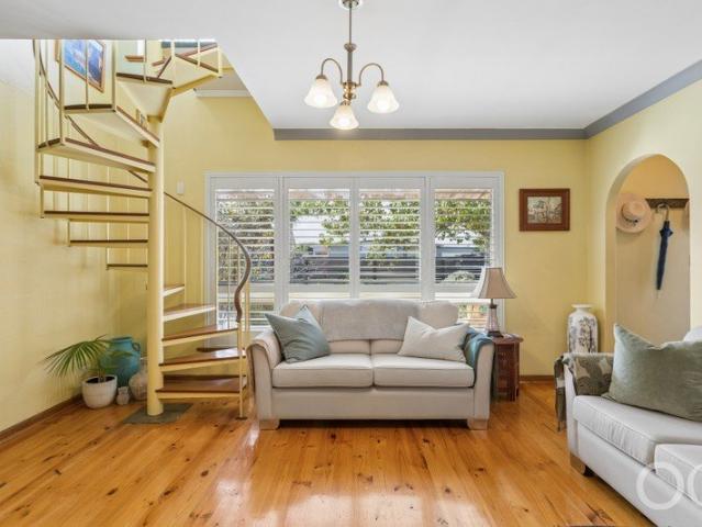 Open the Door to Deceivingly Spacious Dual Living Appeal