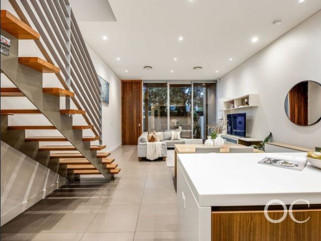 Open the Door to Designer Living in the Heart of Norwood
