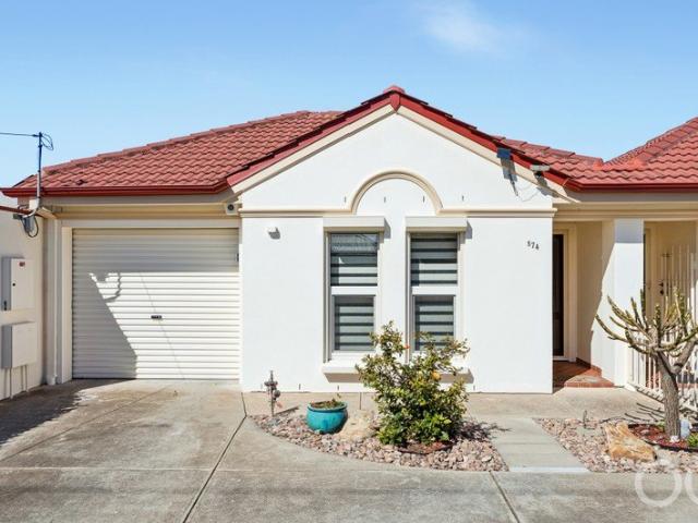 Open the Door to Easy Living Just Moments from the Coast