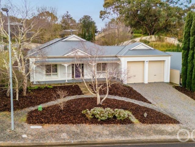 Open the Door to Elevated Golf Course Living with Spacious 4 Bedroom Home