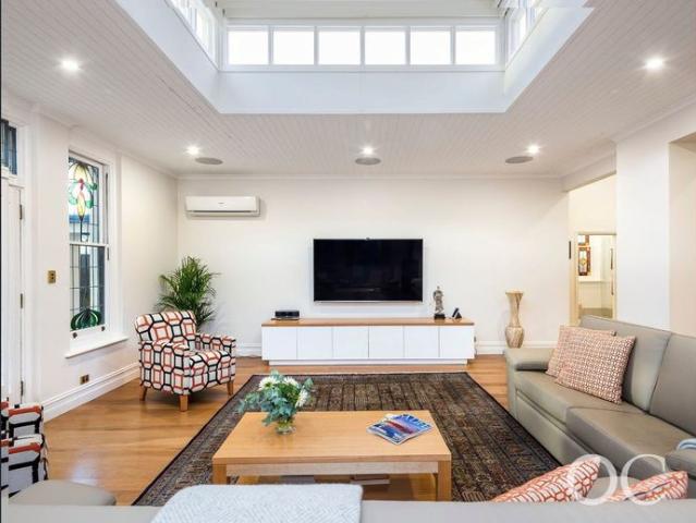 Open the Door To Grand Villa Living in a Coveted Rose Park Corner