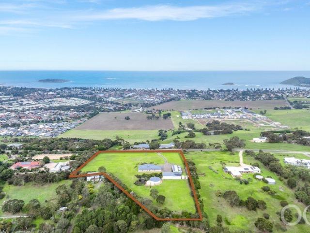 Open the Door to Panoramic Coastal Living on Five Stunning Acres