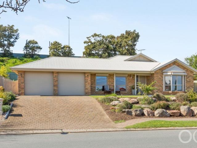 Open the Door to Spacious Family Living with Multiple Zones and Coastal Convenience