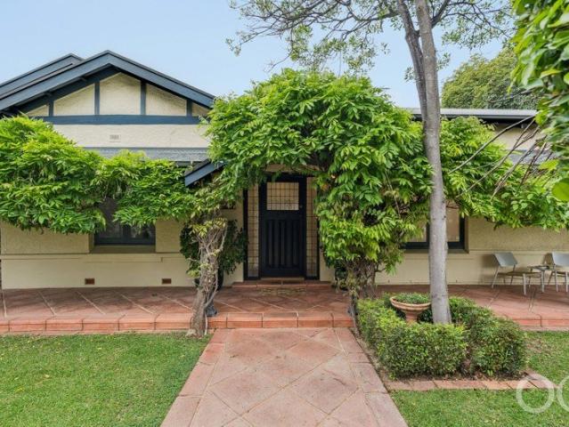 Open the Door to Wisteria Corner, a Century of Character, Little Upkeep and Room for Company