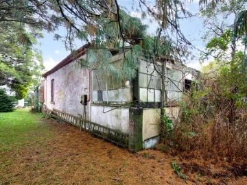 OPPORTUNITY AWAITS RENOVATE OR REBUILD IN VILLAGE SIDE LOCATION