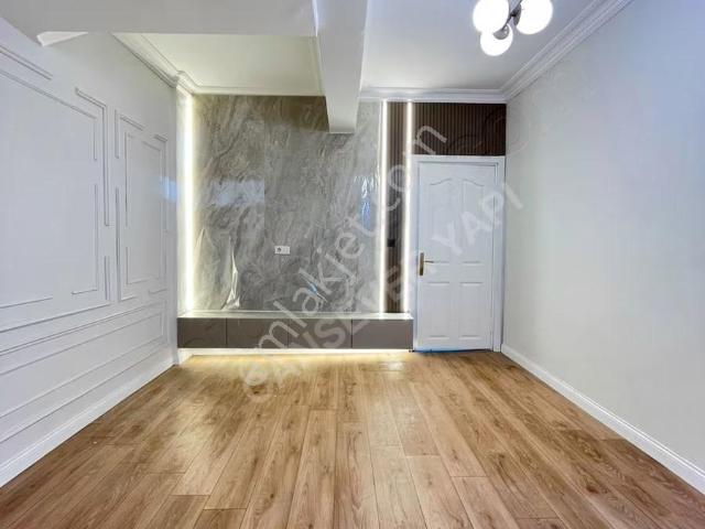 Orhan Gazi Mahallesinde 1+1 Bahçekatı Kiralık Daire