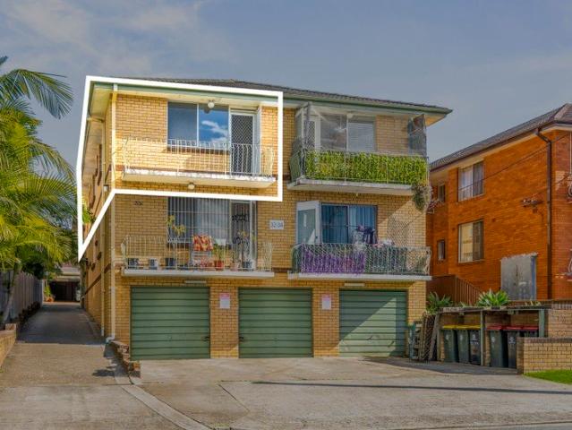 Original, top floor front facing residence in need of updating