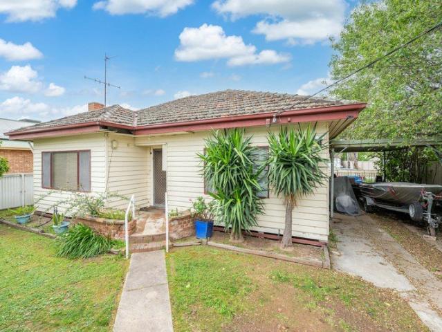 Original Central Home with Endless Potential and Fantastic Shedding!