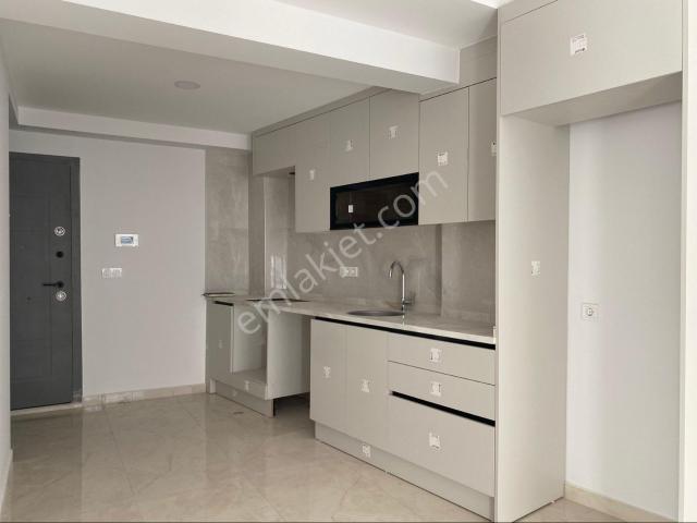 Ortaca Merkezde Satılık 1+1 Sıfır Lüks Ara Kat Asansörlü Daire Ofis