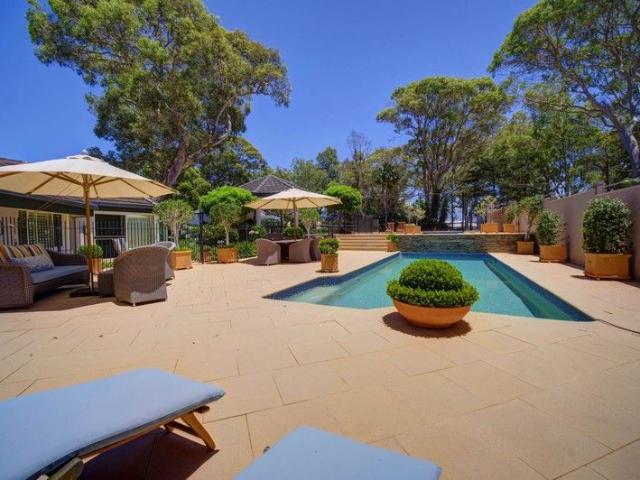 Over two decades in the making, formal gardens and fruit trees create an elegant backdrop for a resort style executive residence
