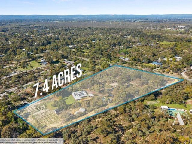 OVER 7.4 ACRES OF DREAM LIVING!