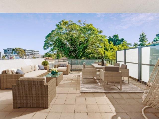 Rare Ground Floor Residence with Oversized Courtyard & Private Entry