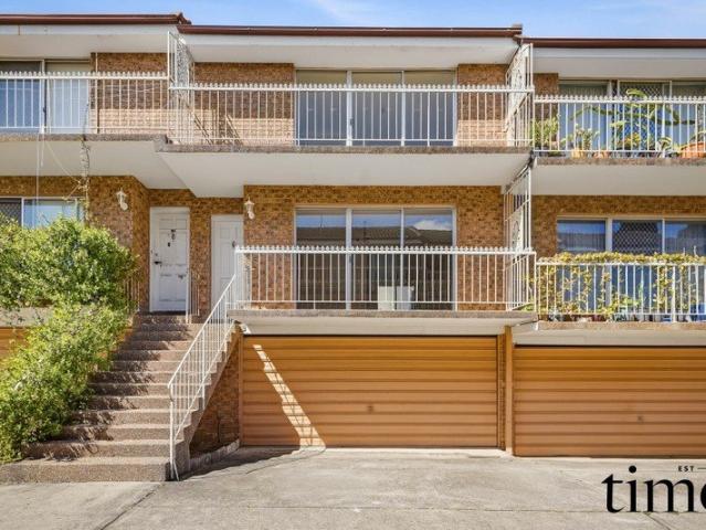 Oversized Townhouse with Outstanding Potential
