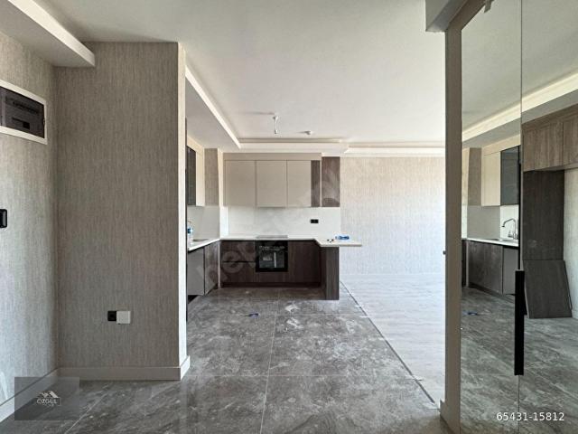 ÖZGÜL EMLAK'tan ULTRA LÜX SİTEDE YERDEN ISITMALI ÇİFT BANYOLU K.OTOPARKLI 2+1 SIFIR DAİRE