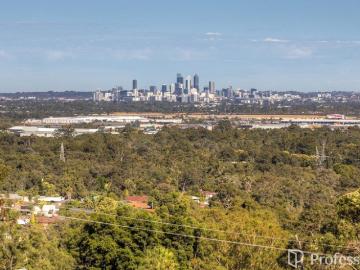 Panoramic City Views on a Rare Half Acre