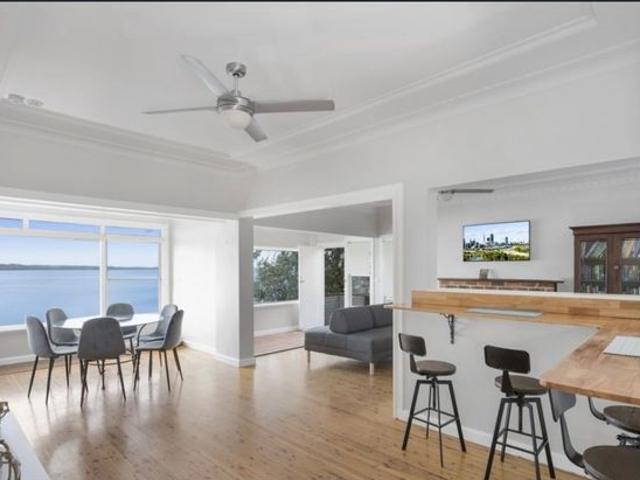 PANORAMIC LAKE VIEWS FROM THIS FAMILY HOME