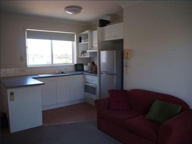 Partially Furnished Southport Gem – 1 Bedroom Unit with Private Deck, Pool & Prime Location!