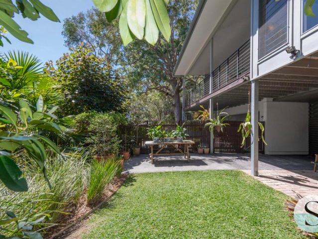 Paradise Found, You'll Want to Get Lost Here in this Surrounded by Nature Impeccably Maintained Home by The Lake & Just 5 Minutes from Shops & Beaches