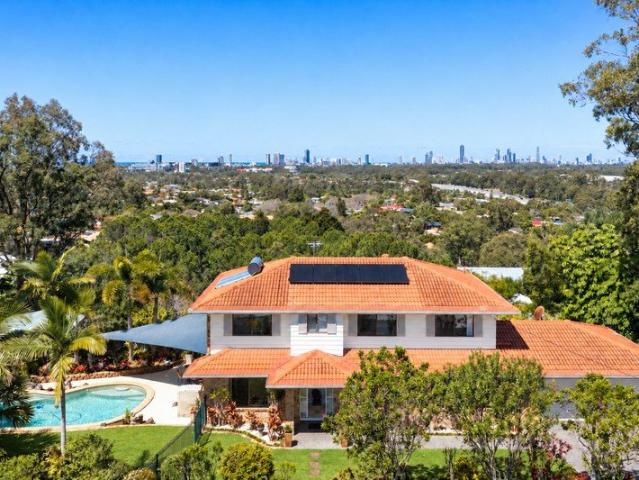 Almost 2 acres, dual living, incredible skyline views, rare development opportunity!