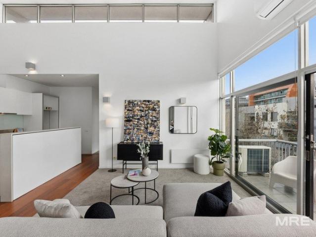 Penthouse Living with Soaring Ceilings and Exceptional Natural Light