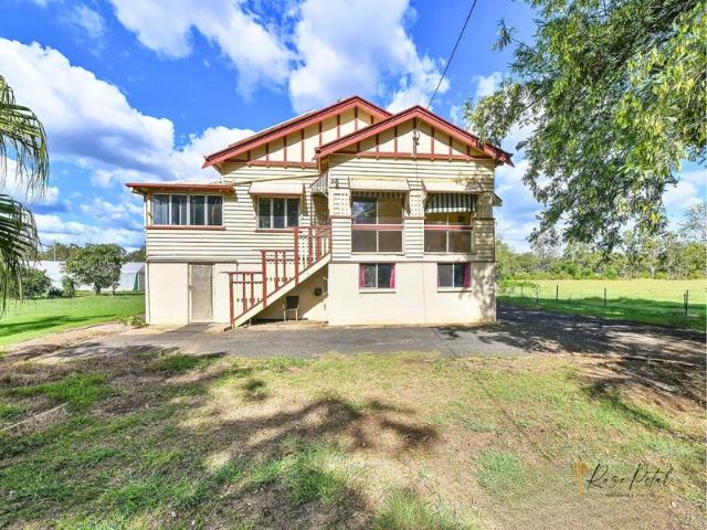 PEACEFUL ACREAGE LIVING WITH CHARACTER, SPACE & COUNTRY CHARM