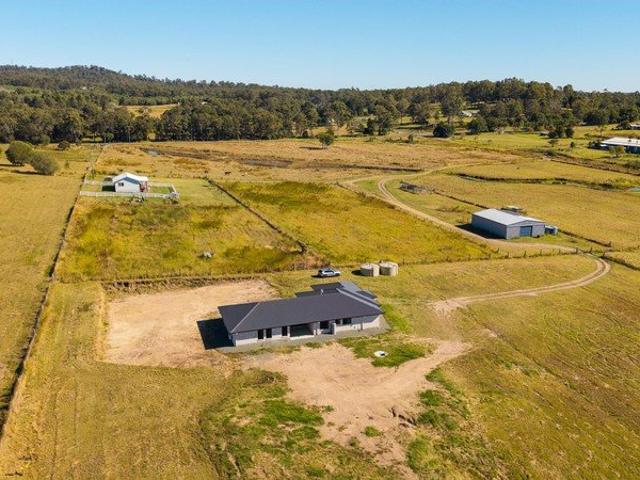 Peaceful Acreage with Two Homes, Abundant Water & Farming Potential!