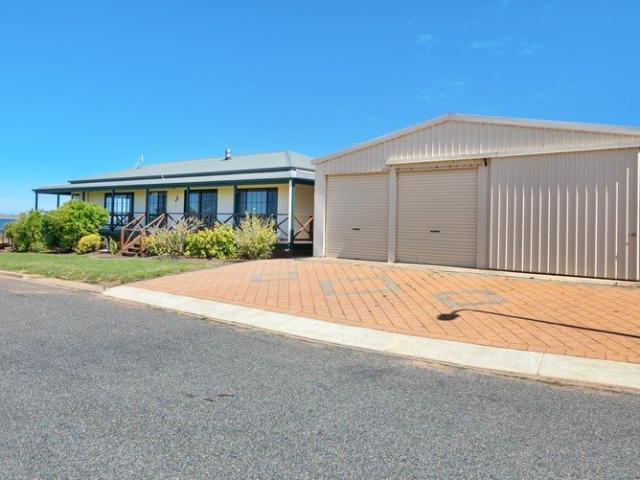 Peaceful Coastal Living with Bay Views & Exceptional Shedding