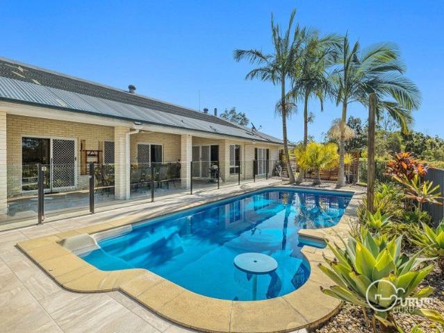 Perfect Acreage Lifestyle featuring the Barn Shed and Summer Pool!