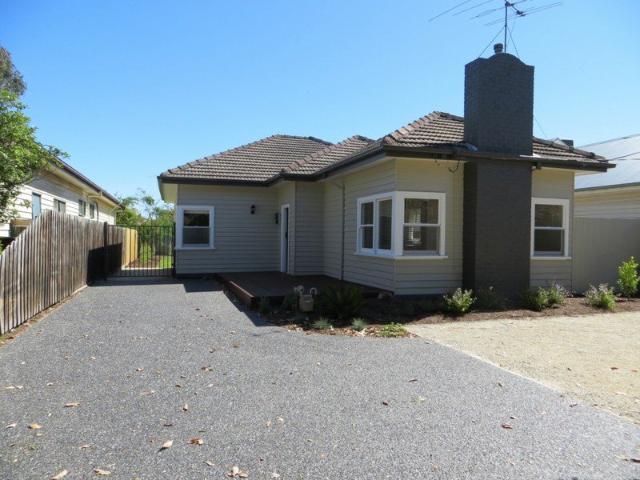 PERFECT HOME IN A BEAUTIFUL TREE LINED STREET