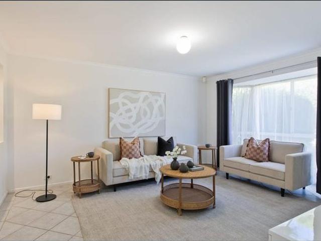 Perfectly suited for families or professionals seeking a comfortable home with multiple living areas