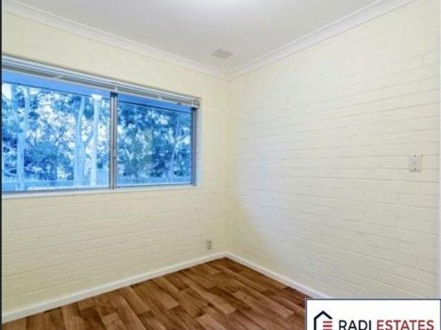 Perfectly Positioned Top Floor Unit in Tree Lined Street
