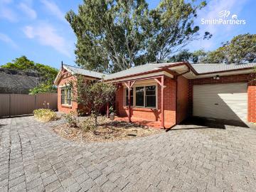 Perfectly Positioned, Low Maintenance Home!