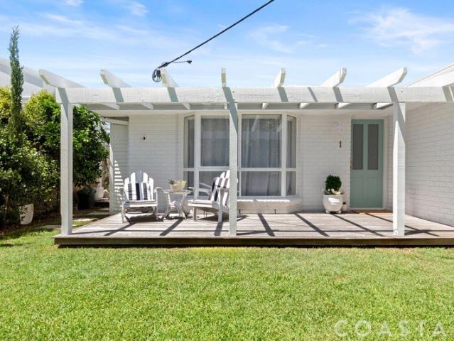Perfectly Positioned, Renovated Single Level Duplex