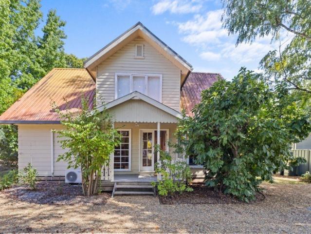 Picturesque, 2 storey, weatherboard cottage