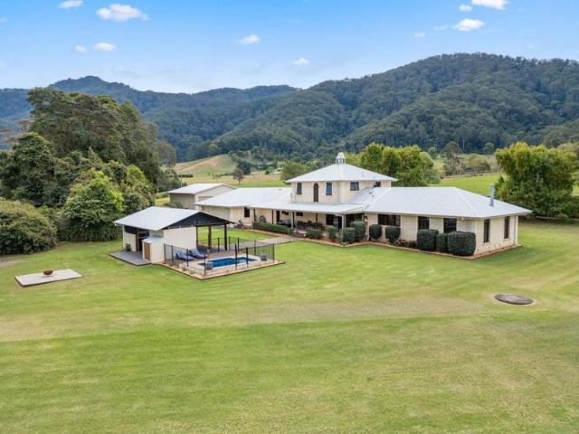 Grand Limestone Home on Picturesque Acreage.