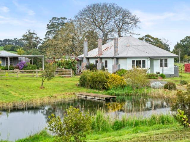 Picturesque Farmhouse Charm on 5.85 Acres