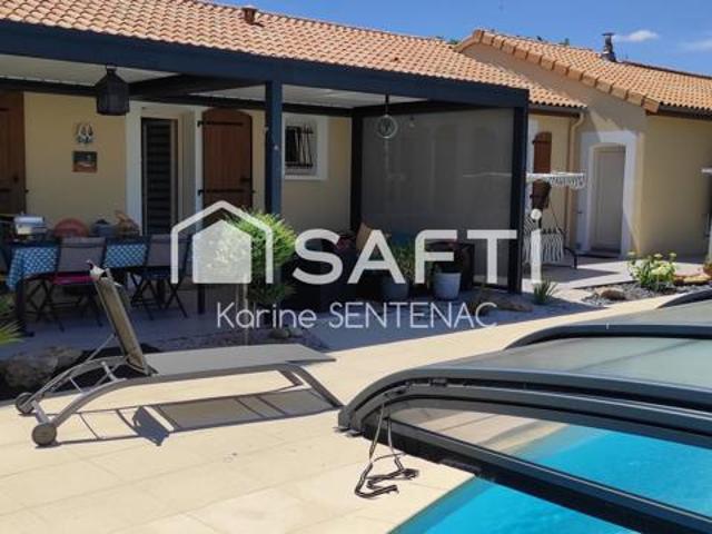 Piscine chaufee et abri pergola rideaux electriques
