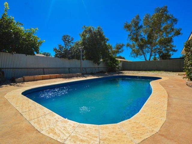 Poolside Living with Modern Updates & Endless Potential!
