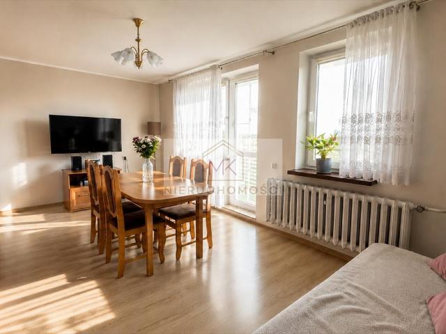 Polecam przestronne 75 m² mieszkanie z balkonem, garażem i ogrodem